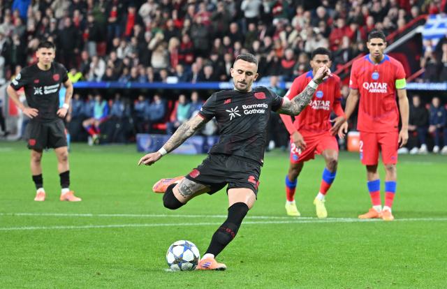 21 October 2025, North Rhine-Westphalia, Leverkusen: Leverkusen's Aleix Garcia converts a penalty during the UEFA Champions League soccer match between Bayer Leverkusen and Paris Saint-Germain at BayArena. Photo: Bernd Thissen/dpa