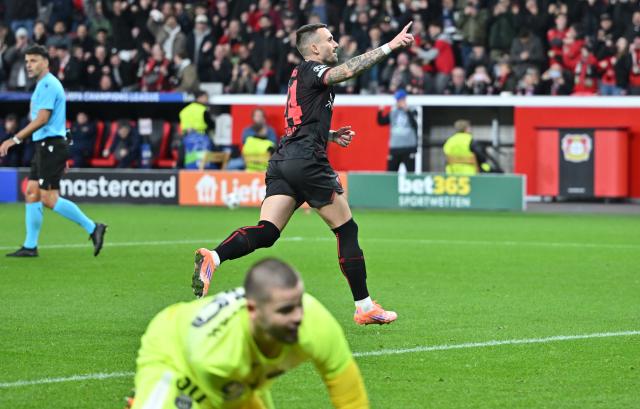 21 October 2025, North Rhine-Westphalia, Leverkusen: Leverkusen's Aleix Garcia celebrates after converting a penalty during the UEFA Champions League soccer match between Bayer Leverkusen and Paris Saint-Germain at BayArena. Photo: Bernd Thissen/dpa