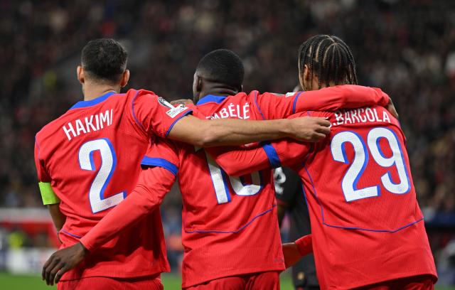 21 October 2025, North Rhine-Westphalia, Leverkusen: Paris St. Germain's Ousmane Dembele (c) celebrates after scoring his side's sixth goal during the UEFA Champions League soccer match between Bayer Leverkusen and Paris Saint-Germain at BayArena. Photo: Bernd Thissen/dpa