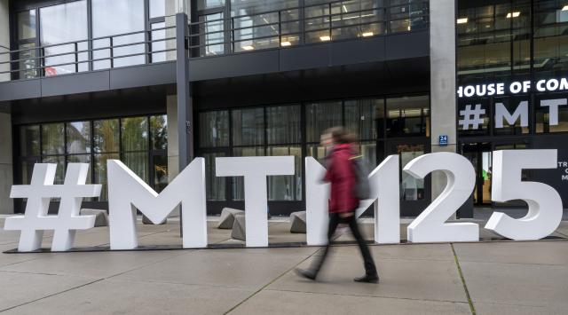 22 October 2025, Bavaria, Munich: The #MTM25 logo of the 39th Media Days Munich stands in front of the House of Communication. Photo: Peter Kneffel/dpa