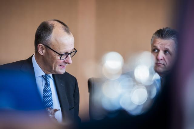 22 October 2025, Berlin: Germany's Chancellor Friedrich Merz sits at the Cabinet table at the start of the German Cabinet meeting in the Chancellery. Photo: Christoph Soeder/dpa
