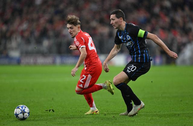 22 October 2025, Bavaria, Munich: Bayern Munich's Lennart Karl (L) and Bruges' Hans Vanaken in action during the UEFA Champions League soccer match between Bayern Munich and FC Bruges at Allianz Arena. Photo: Sven Hoppe/dpa