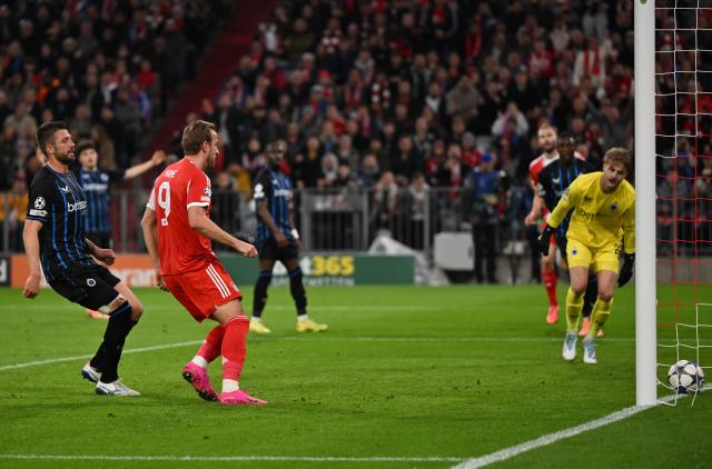 22 October 2025, Bavaria, Munich: Bayern Munich's Harry Kane (C) scores his side's second goal during the UEFA Champions League soccer match between Bayern Munich and FC Bruges at Allianz Arena. Photo: Sven Hoppe/dpa