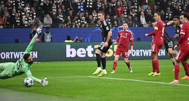 22 October 2025, Hesse, Frankfurt_Main: Eintracht Frankfurt's Rasmus Kristensen (4th R) scores his side's first goal during the UEFA Champions League soccer match between Eintracht Frankfurt and Liverpool FC at the Deutsche Bank Park. Photo: Arne Dedert/dpa