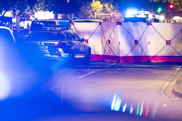 22 October 2025, Lower Saxony, Hanover: A privacy screen is set up at the scene after several people were injured in a shooting in Hanover. Photo: Moritz Frankenberg/dpa