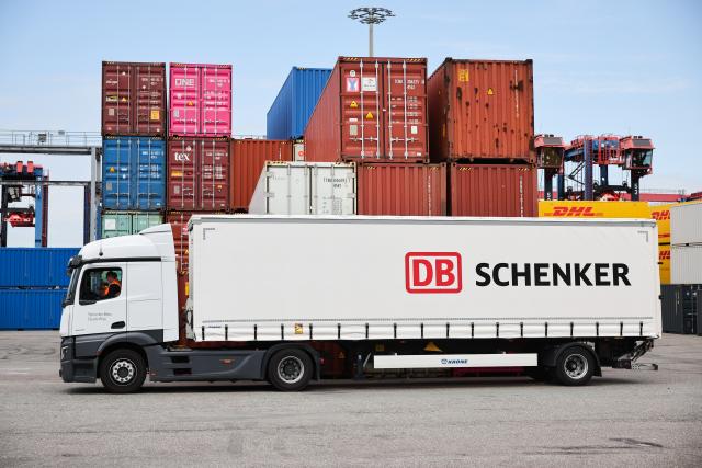 FILED - 08 August 2024, Hamburg: A truck with the Schenker company logo can be seen at the DB Schenker logistics center in the Port of Hamburg. DSV reported a decline in net profit for the third quarter, reflecting higher costs and expenses. 
However, the company recorded a rise in revenue, helped by the contribution from the newly acquired Schenker. Photo: Christian Charisius/dpa