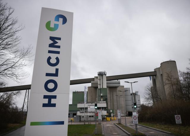 FILED - 06 February 2024, Schleswig-Holstein, Laegerdorf: Entrance to the Holcim cement plant site. Swiss building materials firm Holcim Group saw slightly higher recurring earnings before interest and taxes (EBIT), a key earnings metric, in its third quarter compared to the same period of the previous year, the company reported on Friday. Photo: Christian Charisius/dpa
