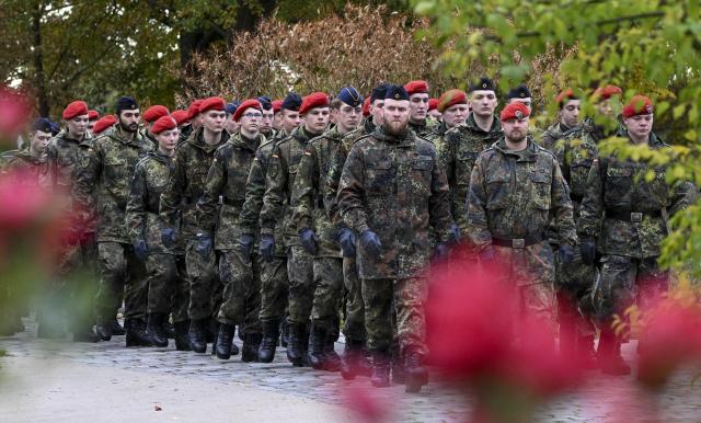 24 October 2025, Brandenburg, Beelitz: The German Bundeswehr recruits from the logistics battalions in Burg, Saxony-Anhalt, and Beelitz march into the city park for their ceremonial swearing-in. Photo: Jens Kalaene/dpa