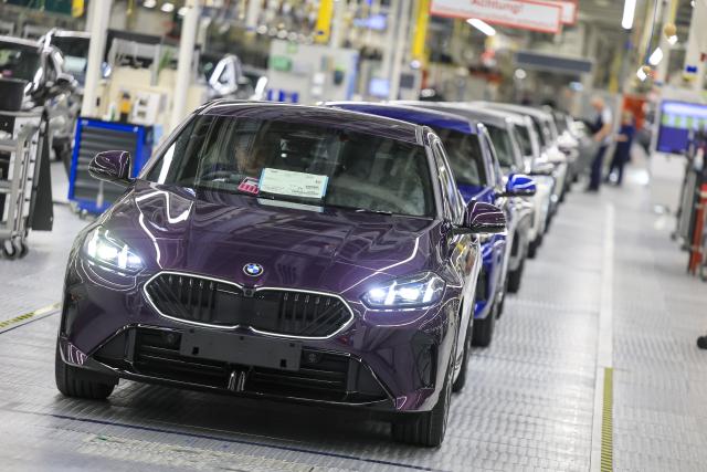 24 October 2025, Saxony, Leipzig: BMW cars roll off the production line at the BMW Group plant in Leipzig. Around 6800 employees currently produce the 1 Series, the 2 Series Gran Coupe, the 2 Series Active Tourer and the Mini Countryman in Leipzig. Photo: Jan Woitas/dpa