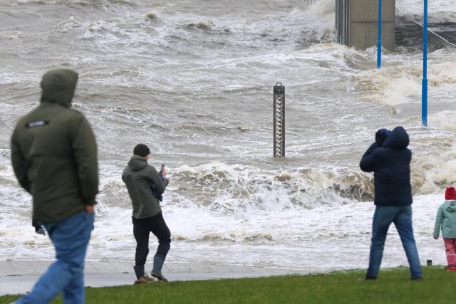 24 October 2025, Schleswig-Holstein, Dagebüll: The water of the North Sea lashes  against the shore at the ferry terminal during the "Joshua" storm surge. Photo: Bodo Marks/dpa