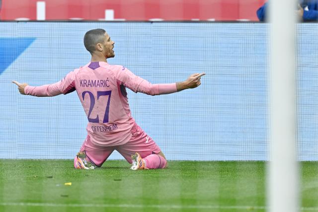 25 October 2025, Sinsheim: Hoffenheim's goalscorer Andrej Kramaric celebrates scoring his side's third goal during the German Bundesliga soccer match between TSG 1899 Hoffenheim and 1. FC Heidenheim at the PreZero Arena. Photo: Uwe Anspach/dpa - IMPORTANT NOTICE: DFL and DFB regulations prohibit any use of photographs as image sequences and/or quasi-video.