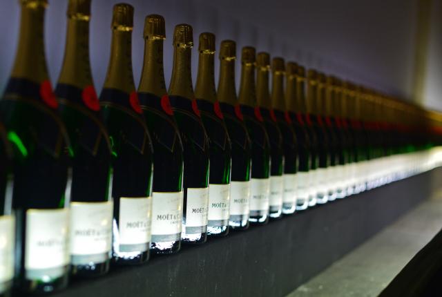 FILED - 04 February 2014, Berlin: Champagne bottles stand on the champagne bar at the Moet & Chandon Grand Scores champagne reception in the former Jandorf department store in Berlin. Photo: Jens Kalaene/dpa