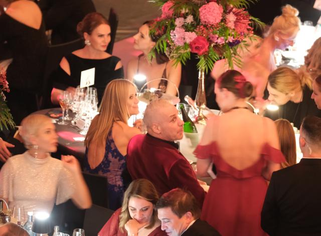 25 October 2025, Saxony, Leipzig: Till Lindemann (C), lead singer of the band Rammstein, sits at a table at the Leipzig Opera Ball. Several hundred people gathered outside the Leipzig Opera House to protest the invitation to the controversial Rammstein singer Till Lindemann to be a special guest at Saturday's Leipzig Opera Ball. Photo: Sebastian Willnow/dpa