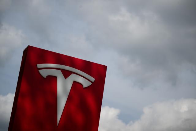 FILED - 23 April 2024, Berlin: The Tesla logo is on a car dealership. Photo: Sebastian Gollnow/dpa