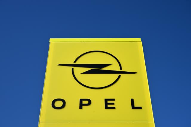 FILED - 23 April 2024, Thuringia, Eisenach: The "Opel" logo and lettering is pictured at the entrance to the Opel Eisenach GmbH plant. Photo: Martin Schutt/dpa