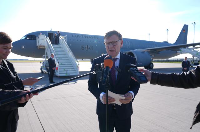 29 October 2025, Brandenburg, Schönefeld: Johann Wadephul, German Minister of Foreign Affairs, makes a press statement at the military section of BER Berlin-Brandenburg Airport in front of an Airbus A 321 of the Air Force's Air Wing for the flight to the Middle East. Wadephul's trip will focus on the further implementation of US President Trump's Gaza peace plan. Photo: Marcus Brandt/dpa
