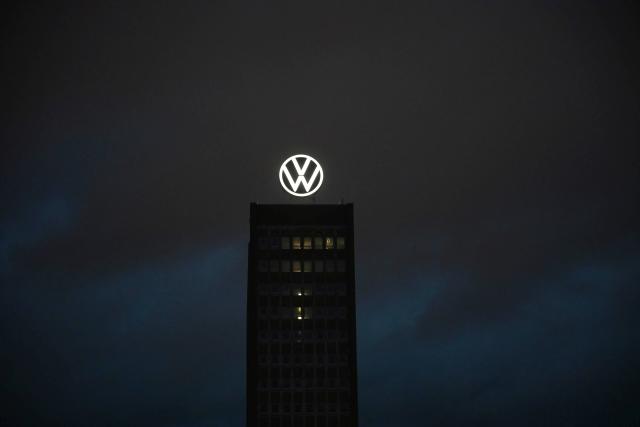 30 October 2025, Lower Saxony, Wolfsburg: The Volkswagen logo shines on the brand tower on the grounds of the VW main plant. The VW Group presents its balance sheet for the third quarter on Thursday. Photo: Shireen Broszies/dpa