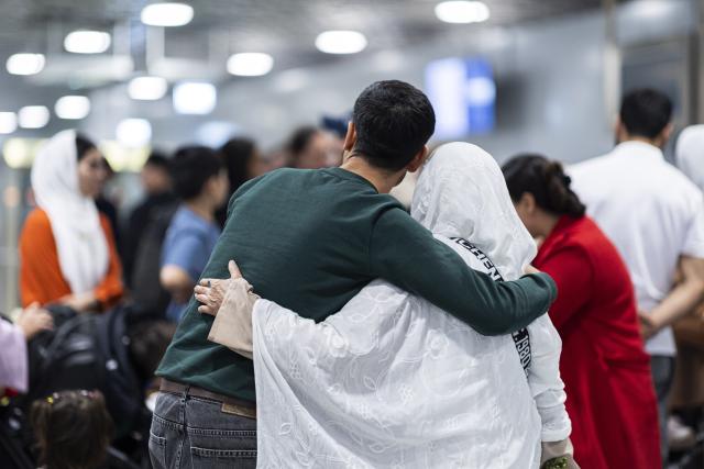 FILED - 24 September 2025, Langenhagen: People from Afghanistan are welcomed after landing at Hanover-Langenhagen Airport. Photo: Michael Matthey/dpa