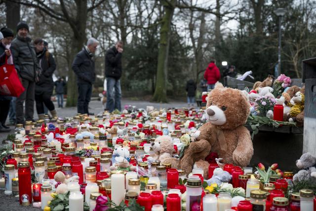 FILED - 24 January 2025, Bavaria, Aschaffenburg: People light candles and lay toys to commemorate the victims of the fatal knife attack, where Afghan man stabbed a group of infants in a German park earlier this year, leaving two people dead. The attacker is to be placed in psychiatric care, after the court ruled that he could not be held criminally responsible due to mental health issues. Photo: Daniel Vogl/dpa