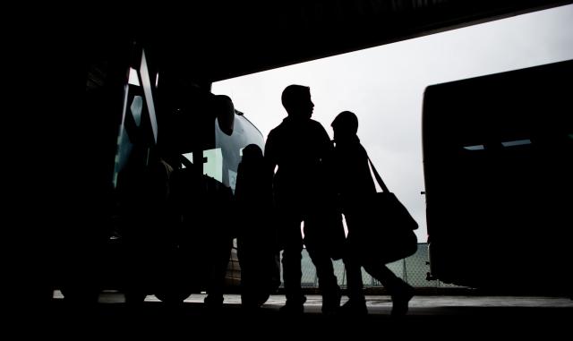 FILED - 11 September 2013, Lower Saxony, Hanover: Refugees from Syria stand at the airport in Hanover. Photo: Julian Stratenschulte/dpa