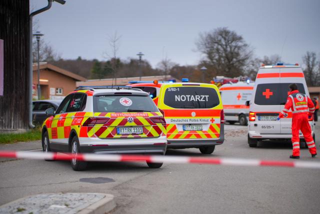 01 November 2025, Baden-Wuerttemberg, Muensingen: Emergency services work at the scene of an accident, where a car had previously hit and seriously injured a pedestrian. Photo: Enrique Kaczor/onw-images/dpa