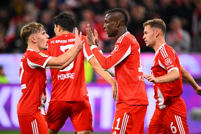 01 November 2025, Bavaria, Munich: Bayern Munich's Nicolas Jackson celebrates scoring his side's second goal  with teammates Lennart Karl (L) and Joshua Kimmich (R) during the German Bundesliga soccer match between FC Bayern Munich and Bayer Leverkusen at Allianz Arena. Photo: Tom Weller/dpa - IMPORTANT NOTICE: DFL and DFB regulations prohibit any use of photographs as image sequences and/or quasi-video.