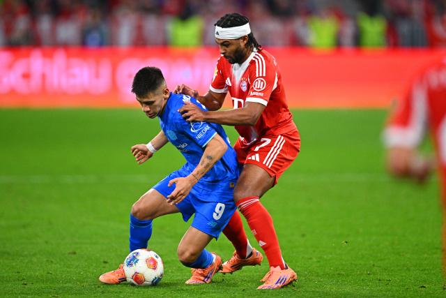 01 November 2025, Bavaria, Munich: Bayern Munich's Serge Gnabry (R) and Bayer Leverkusen's Claudio Echeverri battle for the ball during the German Bundesliga soccer match between FC Bayern Munich and Bayer Leverkusen at Allianz Arena. Photo: Tom Weller/dpa - IMPORTANT NOTICE: DFL and DFB regulations prohibit any use of photographs as image sequences and/or quasi-video.