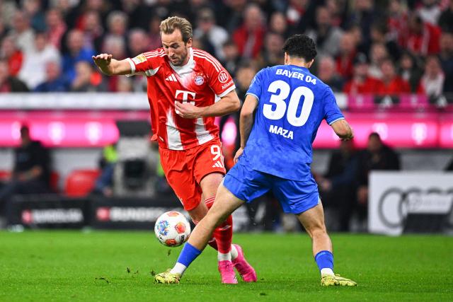 01 November 2025, Bavaria, Munich: Bayern Munich's Harry Kane (L) and Bayer Leverkusen's Ibrahim Maza battle for the ball during the German Bundesliga soccer match between FC Bayern Munich and Bayer Leverkusen at Allianz Arena. Photo: Tom Weller/dpa - IMPORTANT NOTICE: DFL and DFB regulations prohibit any use of photographs as image sequences and/or quasi-video.