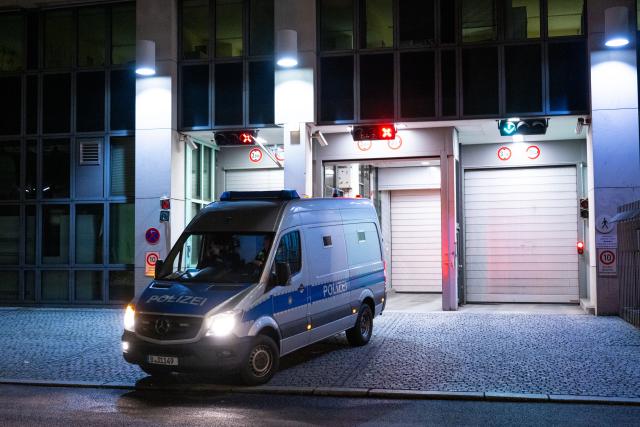 02 November 2025, Berlin: A police vehicle drives out of the Tiergarten district court. Police arrested a man who was allegedly planning a jihadits attack, in Berlin on Saturday. The 22-year-old Syrian is accused of preparing a serious crime endangering the state, said a spokesperson for the Berlin public prosecutor's office. Photo: Christophe Gateau/dpa