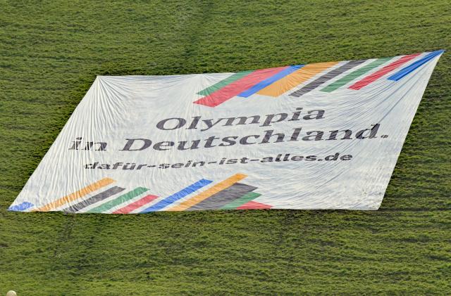 FILED - 15 October 2025, Bavaria, Munich: A banner with the inscription "Olympia in Deutschland". Germans would welcome Olympic Games in the country and 1972 hosts Munich are their preferred city to stage them, according to a survey commissioned by Stern magazine. Photo: Malin Wunderlich/dpa