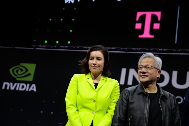 04 November 2025, Berlin: Dorothee Baer (L), Germany's Minister for Research, Technology and Space, and Jensen Huang (R), CEO of NVIDIA, attend the presentation of a new AI factory by Deutsche Telekom and NVIDIA. The joint project aims to lay the foundation for a new era of artificial intelligence (AI) in Germany and Europe. Photo: Carsten Koall/dpa