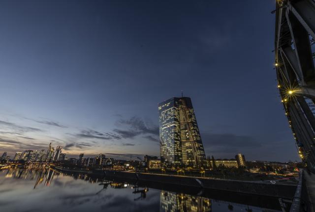 06 November 2025, Hesse, Frankfurt/Main: The lights in the offices of the European Central Bank (ECB) shine in the last light of day. Photo: Boris Roessler/dpa