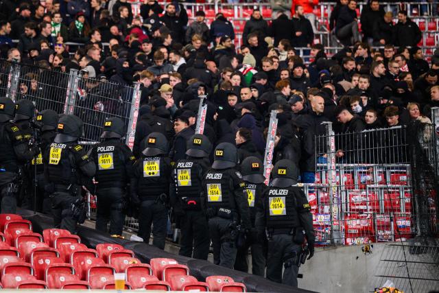 06 November 2025, Baden-Wuerttemberg, Stuttgart: Police officers stand in front of a broken fence in front of the Feyenoord Rotterdam fan block after the UEFA Europa League soccer match between VfB Stuttgart and Feyenoord Rotterdam at MHPArena. Photo: Tom Weller/dpa