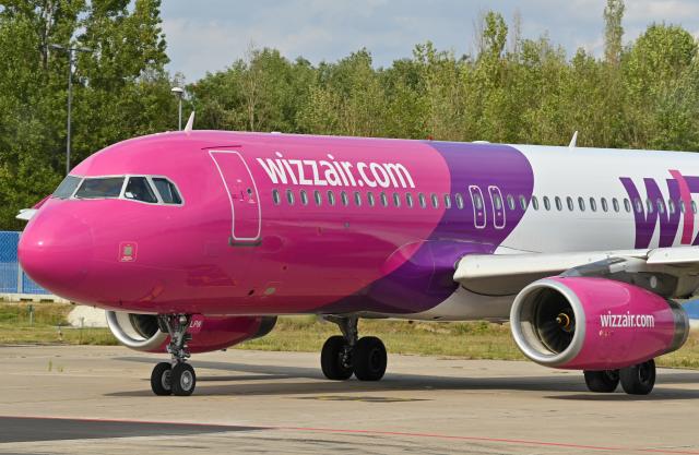 FILED - 24 August 2020, Brandenburg, Schoenefeld: A passenger plane of the Hungarian low-cost airline Wizz Air Hungary Ltd. is parked at Berlin-Schoenefeld Airport. Photo: Patrick Pleul/dpa-Zentralbild/dpa