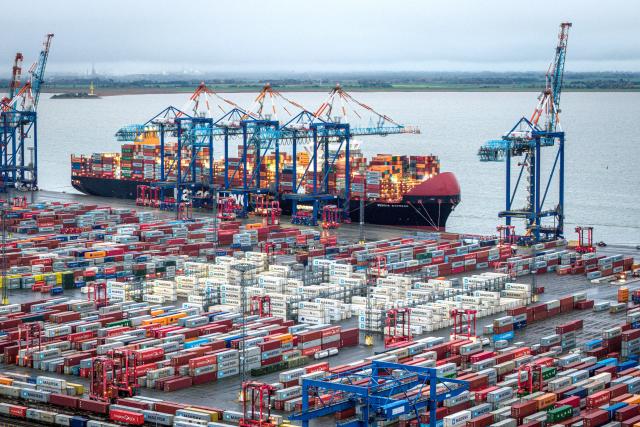 FILED - 14 October 2025, Bremen, Bremerhaven: An aerial photo of a container ships in port. German exports to the United States grew for the first time in six months in September, official figures showed on Friday, in a sign that trading is adjusting to new tariffs imposed by the Trump administration. Photo: Sina Schuldt/dpa