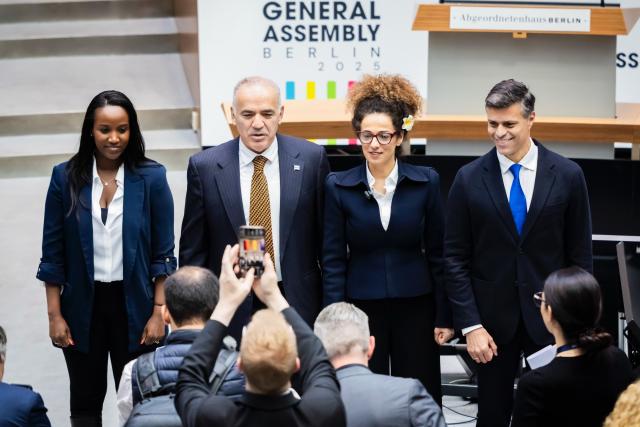 08 November 2025, Berlin: (L-R) Carine Kanimba, spokesperson of the World Liberty Congress, Garri Kasparov, Vice President and activist, Masih Alinedschad, President and Iranian activist, and Leopoldo Lopez, Secretary General and Venezuelan opposition politician, stand before the opening session of the World Liberty Congress at the Berlin House of Representatives marking the start of Berlin Freedom Week. Photo: Christoph Soeder/dpa