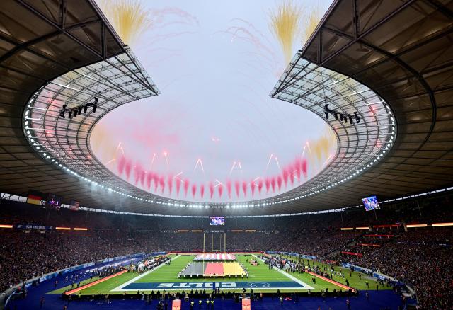 09 November 2025, Berlin: Fireworks seen after the anthems before the NFL American football match between Indianapolis Colts and Atlanta Falcons at Olympiastadion Berlin. Photo: Sebastian Christoph Gollnow/dpa