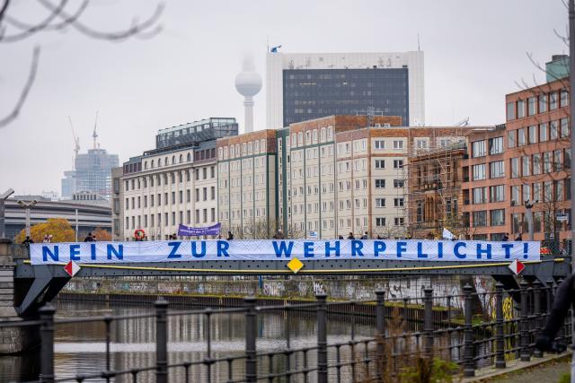 10 November 2025, Berlin: Activists from the peace organization ippnw have stretched a banner reading "No to compulsory military service" across the Spree. An expert hearing of the Bundestag's Defense Committee on the Military Service Act is to discuss compulsory military service. Photo: Michael Kappeler/dpa