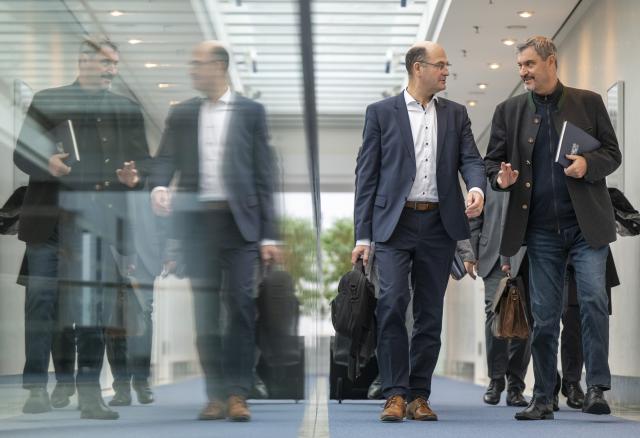 10 November 2025, Bavaria, Munich: Bavarian Minister for Finance and Home Affairs Albert Fueracker (L) and Minister President of Bavaria Markus Soeder walk across the corridor of the Bavarian State Chancellery for the cabinet's closed meeting on the 2026/2027 double budget. Photo: Peter Kneffel/dpa