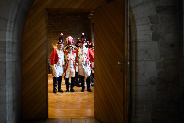 11 November 2025, Lower Saxony, Brunswick: Carnival members of the Karneval-Vereinigung der Rheinlaender e.V. stand at the carnival kick-off in the Old Town Hall. Photo: Julian Stratenschulte/dpa