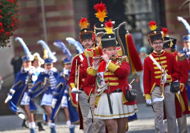 11 November 2025, Bavaria, Wuerzburg: Members of the Prinzengarde parade through the city center at the opening of the carnival season. Photo: Karl-Josef Hildenbrand/dpa