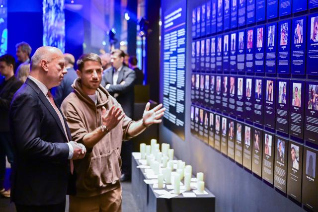 11 November 2025, Berlin: Kai Wegner (L), Governing Mayor of Berlin, stands next to Omri Sasi, producer of the Nova Festival and the Nova Music Festival exhibition, during a tour of the Nova Music Festival exhibition at Berlin Tempelhof Airport for the Berlin Senate. Photo: Sebastian Christoph Gollnow/dpa