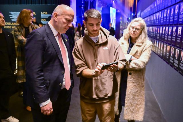 11 November 2025, Berlin: Kai Wegner (L), Governing Mayor of Berlin, and Ute Bonde (R), Berlin Senator for Mobility, Transport, Climate Protection and the Environment, stand next to Omri Sasi, producer of the Nova Festival and the Nova Music Festival exhibition, during a tour of the Nova Music Festival exhibition at Berlin Tempelhof Airport for the Berlin Senate. Photo: Sebastian Christoph Gollnow/dpa