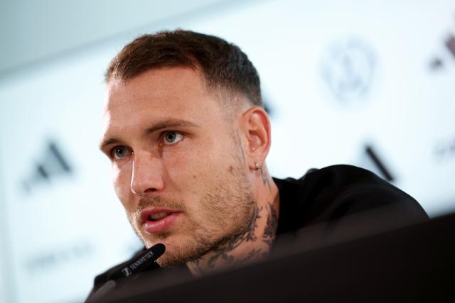11 November 2025, Lower Saxony, Wolfsburg: Germany's David Raum speaks during the team's press conference ahead of the FIFA World Cup European qualifying soccer matches against Luxembug and Slovakia. Photo: Christian Charisius/dpa