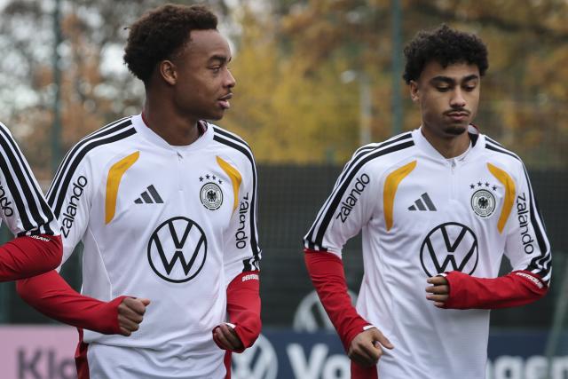 11 November 2025, Lower Saxony, Wolfsburg: Germany's Assan Ouedraogo (L) and Nathaniel Brown take part in the team's training session ahead of the FIFA World Cup European qualifying soccer matches against Luxembug and Slovakia. Photo: Christian Charisius/dpa