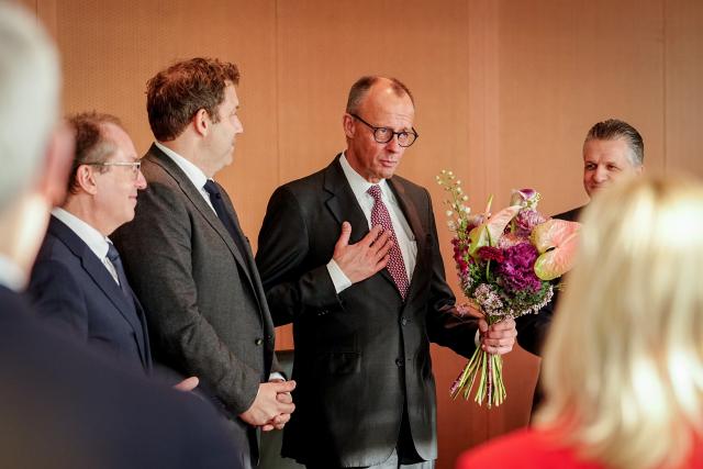 12 November 2025, Berlin: German Chancellor Friedrich Merz  accepts the applause and flowers on the occasion of his 70th birthday on November 11, 2025 at the beginning of the meeting of the Federal Cabinet in the Federal Chancellery from Lars Klingbeil (SPD), Federal Minister of Finance, Vice Chancellor and SPD Federal Chairman, Alexander Dobrindt (L), German Minister of the Interior, and Thorsten Frei (R), Head of the German Chancellery and Federal Minister for Special Tasks. Photo: Kay Nietfeld/dpa