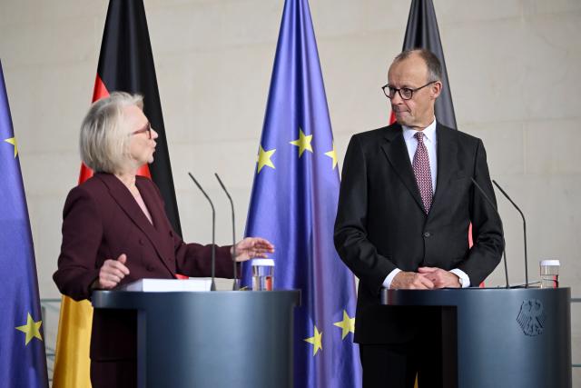 12 November 2025, Berlin: German Chancellor Friedrich Merz  and Monika Schnitzer, Chairwoman of the German Council of Economic Experts, at the presentation of the annual report of the German Council of Economic Experts. Photo: Britta Pedersen/dpa