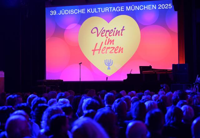 12 November 2025, Bavaria, Munich: The motto of the opening festival of the 39th Jewish Cultural Days Munich of the Jewish Community of Munich and Upper Bavaria "United in Heart" is projected onto the wall on the stage. Photo: Malin Wunderlich/dpa
