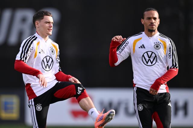 13 November 2025, Lower Saxony, Wolfsburg: Germany's Florian Wirtz and Leroy Sane participate in a training session ahead of Friday's FIFA World Cup qualifier soccer match against Luxembourg. Photo: David Inderlied/dpa
