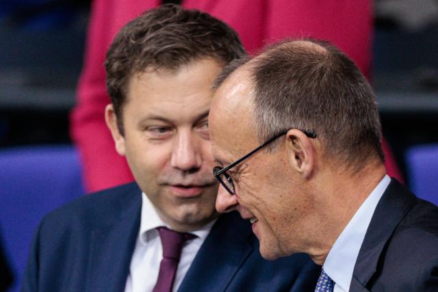 14 November 2025, Berlin: Lars Klingbeil (L), German Minister of Finance, and German Chancellor Friedrich Merz at the start of the plenary session in the German Bundestag. Photo: Carsten Koall/dpa